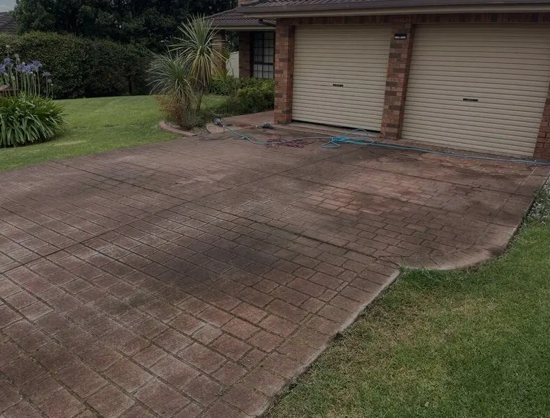 Paved driveway before pressure washing, Metro Wide Roofing