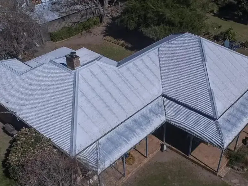 Weathered metal roof before restoration, Metro Wide Roofing