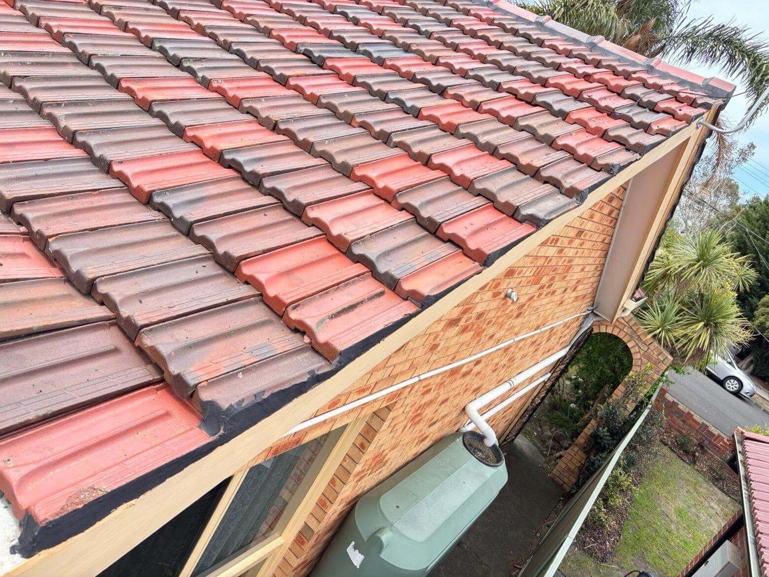 Roof washing in progress on a tiled roof in Melbourne, Metro Wide Roofing
